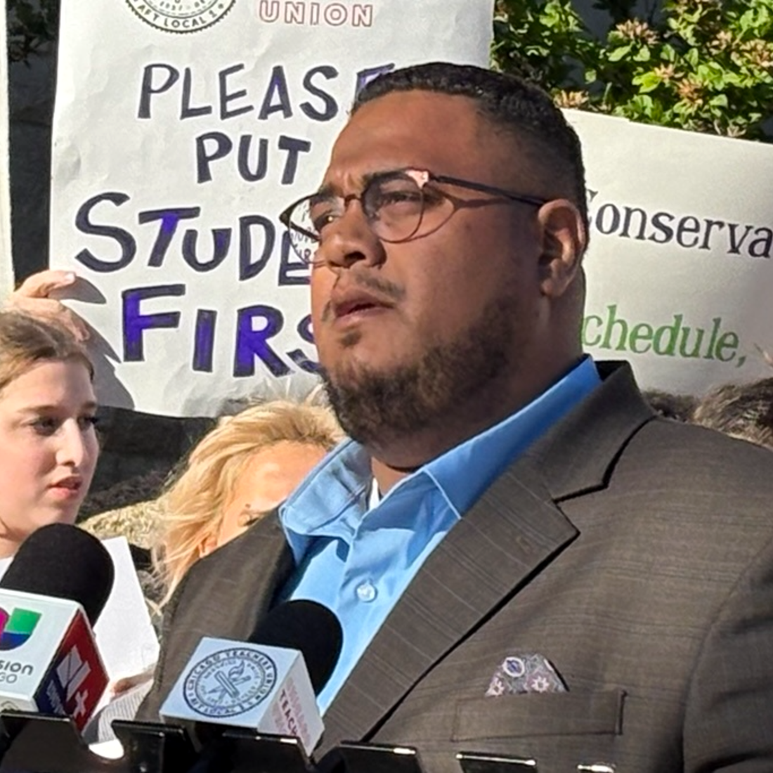 Dr. Angel L. Velez speaking at a podium