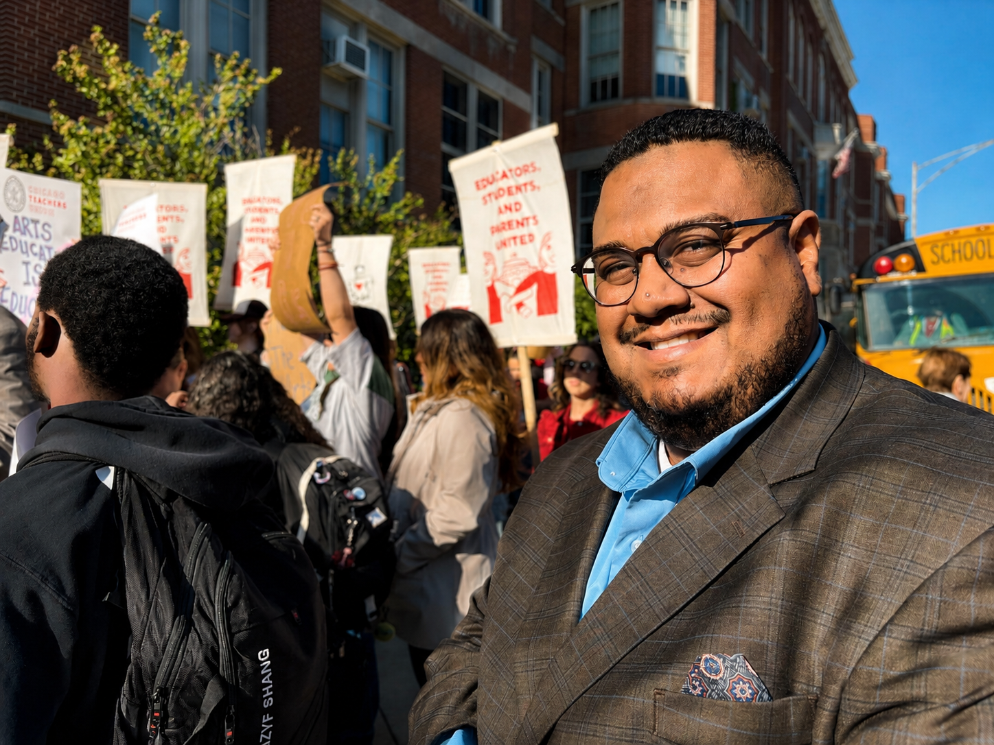 Dr. Angel L. Velez at a rally with educators, students, and parents outside a Chicago public school